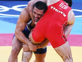 The IOC is threatening to remove wrestling, which has been around since 700 B.C., from the Olympic Games. (QMI Agency)