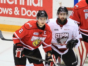 Owen Sound captain Keevin Cutting guards Cody McNaughton of the Guelph Storm during the second period of Wednesday night’s game, Cutting’s 313th as a member of the Attack.