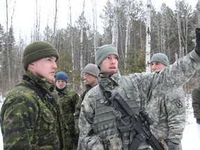 Lieut. Dan Stephan Canadian Second Platoon leader talks strategy with 2nd Lieut. Owen Pataki American Second Platoon leader during exercise "Frozen Dragoon" at the Canadian Forces Burwash Training Facility on Wednesday afternoon.
GINO DONATO/THE SUDBURY STAR