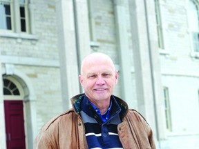 Geoff Webster stands in front of Napanee's historic court house, which is located just up the street from where he lives.