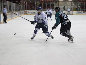 The Melfort Mustangs' Adam Fauchoux works his way past a La Ronge Ice Wolves' player during the Mustangs' 2-1 overtime loss to La Ronge on Wednesday, February 13 at the Northern Lights Palace.