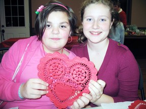 Amberlee Morgan, 10, and Georgia Nix, 11, make Valentine's themed crafts during the Girl Guides' meeting  on Feb. 13.   (SARAH DOKTOR Simcoe Reformer)