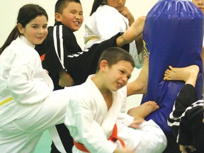 Students from Kenora’s Can Te IsshinRyu Karate school practice their kicks after a great preformance on the weekend in Selkirk.
GRACE PROTOPAPAS/Daily Miner and News