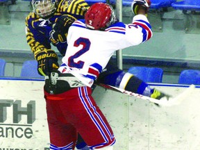 Fort Saskatchewan Bantam Ranger forward Josh Micklich slams a Leduc Wheat King into the boards in Sunday’s 3-1 loss.
Photo by Aaron Taylor/Fort Saskatchewan Record/QMI Agency