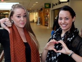 Leah, left, and Sarah Kordos show what they think of Valentine’s Day this year. Today spoke to a handful of Fort McMurray residents about the notorious holiday, its commercialization, and how they are planning to spend the romantic occasion.