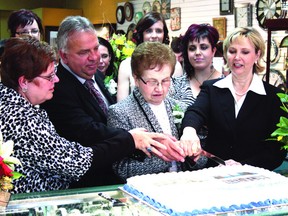 Members of the Gamache family and Mayor Gale Katchur cut the cake at the 65th anniversary celebration at Roland’s Jewelers.
Photo by Aaron Taylor/Fort Saskatchewan Record/QMI Agency