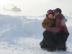 Lynn Mayer embraces her three-year-old grandson Kian Maya as they observe the CH-146 Griffon land at Cochrane Airport during Exercise TRILLIUM RESPONSE. Lynn Mayer is a fuel attendant at the Cochrane Airport. Exercise TRILLIUM RESPONSE is Joint Task Force Central’s annual field training exercise aimed at developing and maintaining the capability and expertise to conduct various operations in remote areas and austere conditions. This year’ s exercise focuses on a Defence of Canada scenario in a remote area of Northern Ontario. The exercise is providing challenging training to Canadian Army and Royal Canadian Air Force personnel, allowing them to regenerate winter field skills operating in harsh weather conditions.