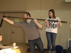 Local filmmaker Scott Belyea (centre) shows Emily Schuett how to hold the boom during a scene while Tennyson D'Onofrio waits for filming to start. This week the crew is taking part in the Youth Film Making Challenge last April. This year, some changes are being made to the program for this year, and applications are now being accepted.