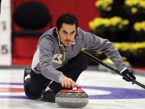 Aaron Sluchinski delivers a shot during the Alberta Men’s Curling Championships in Leduc on Friday. 
PERRY MAH/QMI AGENCY