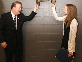 Emily Lambert, right, and Mayor Peter Brown prepared to pull the shroud off of Lambert’s plaque on the Elite Athlete Wall at Genesis Place.
TESSA CLAYTON/AIRDRIE ECHO