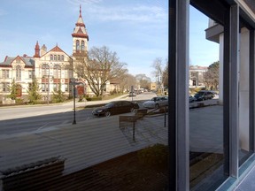 Perth County Courthouse is reflected in a window of the downtown Scotiabank building in Stratford. (Postmedia Network file photo)