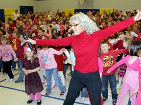 Lisa Amelia-Morris, of F.I.R.E. (Freedom, Inspire, Respect, Empower), leads Tilbury Area Public School students in a dance on Thursday Feb. 14, 2013. It was part of a day of action to raise awareness concerning violence against women. (TREVOR TERFLOTH, The Chatham Daily News)