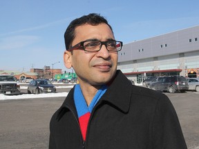 Dr. Ajay Agarwal stands on Ontario Street in front of the parking lot across the street from the K-Rock Centre.
Michael Lea The Whig-Standard