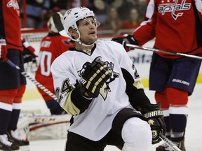 Pittsburgh Penguins Matt Cooke (C) celebrates his goal in the first period of their NHL hockey game against the Washington Capitals in Washington February 3, 2013.  REUTERS/Gary Cameron