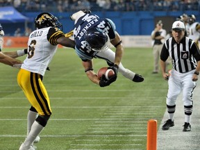 Running back Chad Kackert (right) flourished in the Double Blue last season, helping lead the Argonauts to a Grey Cup title. But it’s believed the defending champs are interested in acquiring free agent Brandon Whitaker, meaning it’s possible Kackert, who is also a free agent, could wind up with the Alouettes. (REUTERS)
