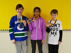 Grade 6 students Sasha Morano, Diya Parikh and Grade 5 student Patrick Fenton who were the top three public speaking winners. Morano was awarded first place in her division for her speech on the NHL lockout, Parikh was awarded second place in her division for her speech on superstitions and Fenton was awarded third place for his speech on dogs.