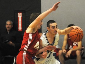 Michael Rocca drives against a defender. St. Christopher Cyclones vs London Basketball Academy Wednesday Feb. 13, 2013 at St. Christopher School in Sarnia, Ont. TYLER KULA/ THE OBSERVER/ QMI AGENCY