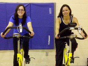 Kandis Hodgins, left, is organizing a spinathon April 14 to raise money for the MS Society's Sarnia-Lambton branch. The 24-year-old Grand Bend woman has been fundraising for the society since her mother was diagnosed with multiple sclerosis 18 years ago. She's pictured here with Mary Ann Riggi, supervisor at the Lambton Shores YMCA. SUBMITTED PHOTO