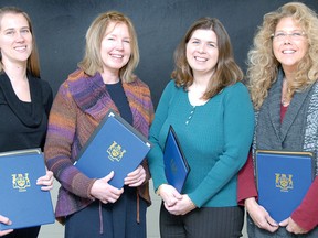 Shown receiving Workplace Champion awards for their workplaces' commitment to the Neighbours, Friends and Families at Work training program are, from left, Meghan Stansell (Cooper Standard), Susan Melkert (Family Services Perth-Huron), Louanne Piper (Supervised Access Visitation and Exchange Huron-Perth), and Lisa Wilde (Emily Murphy Centre and Supervised Access Program Huron-Perth). Also recognized was Optimism Place Women’s Shelter and Support Services. (SCOTT WISHART, The Beacon Herald)