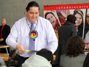 Bob Goulais, of Nipissing First Nation, performs a "drive-by smudge" at the Aboriginal Issues panel discussion Friday at the Harris Learning Library at the Education Centre. Speakers discussed the Idle No More movement and the effect of federal legislation on First Nations, Metis and Inuit peoples.