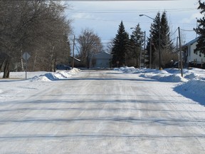 This view of 48 Avenue looking east from 52 Street on Wednesday, Feb. 13 shows a residential area. The condition of the street is obscured by snow.