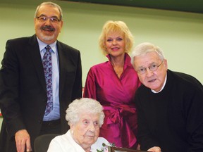 Friends and family gathered at the Golden Manor to wish Agnes Aquino, front row, a happy 100th birthday. Along to join Timmins' most recent centenarian in celebration were, from left, Jim Aquino Jr., Golden Manor administrator Heather Bozzer, and Coun. Michael Doody.