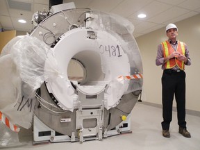 Cornwall Community Hospital vice-president of support services Alan Greig shows off the new MRI machine on Friday . The $3 million machine sits in a $3 million room.
Staff photo/KATHRYN BURNHAM