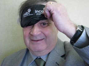 Event organizer Phil Egan sports one of the blindfolds that people will wear during Dining in the Dark. The CNIB fundraiser hopes to give a taste of the obstacles the visually impaired face on a daily basis.