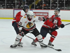 Brockville Braves' forward Hayden Hulton protects the puck against two players from the Ottawa Senators during Friday's 4-3 shootout win (NICK GARDINER/The Recorder and Times).