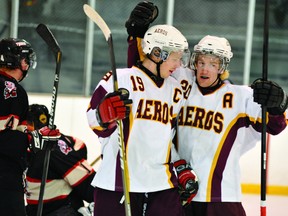 Athens Aeros centre Pat Cameron (19) and left winger left winger Michael Byrne celebrate Cameron's goal, the team's first, in a 6-3 win over the Brockville Tikis in Game One of their Rideau Division Jr. B playoff series (STEVE PETTIBONE/The Recorder and Times).