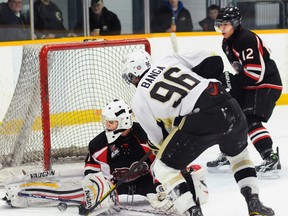 Pickering Panthers goalie J.P. Cesario robs Trenton Golden Hawks' Sammy Banga during the Hawks' 6-3 win Friday at the Community Gardens. The Hawks scored four unanswered third period goals to pull off the win and clinch first place in the OJHL's Northeast Conference.