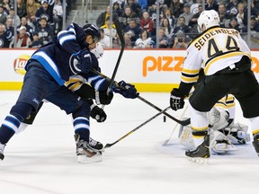 Winnipeg Jets' Evander Kane scores on the Boston Bruins during the second period of their game on Sunday. (FRED GREENSLADE/Reuters)