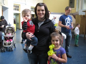 Angie Campbell holding her son Khalil Mansour, 11 months, and with her daughter Nahla Mansour, 4. (Rebecca Anne Field, Special to the Free Press)