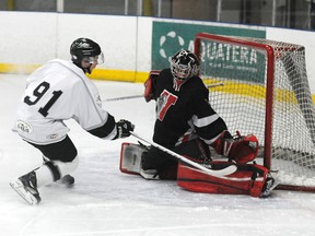Vipers goalie Braydon Glinnum gets his pad out to stop Joey Wamsteeker. The Grande Prairie Kings completed a three-game sweep of the Sexsmith Vipers with a 6-0 victory in North West Junior Hockey League quarter-final action at the Coca-Cola Centre on Sunday. (TERRY FARRELL/DAILY HERALD-TRIBUNE)