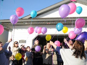 Friends and family of missing person Jody Rae Smith-Hockett gather at a private residence on Sunday to mark the fourth year since her disappearance. After a moment of silence, they release balloons into the sky in her memory. Hockett went missing in February 2009 from Grande Prairie.  ELIZABETH McSHEFFREY/DAILY HERALD-TRIBUNE