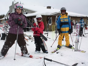 The Kamiskotia Snow Resort chalet was packed and the slopes were busy as families took advantage of half-price rentals and lift tickets for Family Day. Young skiers, from left, Autumn Walton, and sibling duo Summer and Noah Basaraba, suit up just outside the Kamiskotia chalet before heading back up for another run down the mountain.