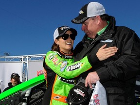 Danica Patrick celebrates securing the pole position with the fastest lap for the Daytona 500 with her crew chief Tony Gibson on Sunday. (REUTERS)