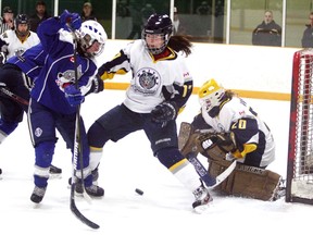 Sudbury Lady Wolves' Karli Shell, left, looks for a rebound while Whitby Wolves defender Jaime Fox defends and Whitby goaltender Paige White tries to jump on the loose puck during Sudbury Snowflake Challenge Girls Hockey Tournament midget AA action at Gerry McCrory Countryside Arena on Saturday. Final score was 2-2. Ben Leeson/The Sudbury Star/QMI Agency