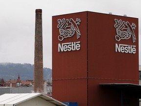 A Nestle logo is pictured on a factory in Orbe April 20, 2012. (REUTERS/Joao Vieria)
