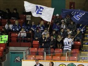 Before the North East Midget AA Hockey Club took to the ice at the Northern Lights Palace fans waved flags.