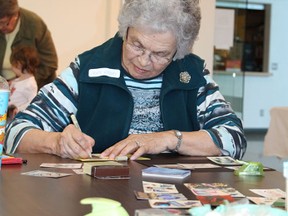 Jean Groat works on creating some artist trading cards at a workshop on Saturday, February 16 at the Kerry Vickar Centre. The cards are created and traded with the art display at the Sherven-Smith Art Gallery.