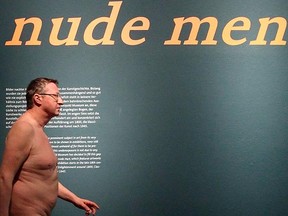 A nude visitor walks through the art exhibition "Nude Men" at Leopold museum in Vienna February 18, 2013. The museum welcomed naked viewers from the public on Monday in an after-hours showing of the exhibition, which has been extended to run until March 4, 2013. REUTERS/Heinz-Peter Bader