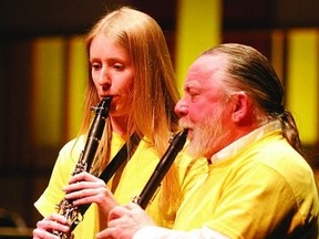 Jesse Luimes (left) and Gordon Craig demonstrate the sound made by a clarinet.