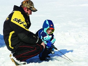 Mike Lake and son Jacob, six, enjoy ice fishing in Loughborough  Lake.       Adrienne Babcock - Kingston This Week