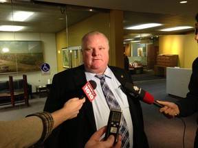 Mayor Rob Ford speaks to reporters outside his City Hall office on Tuesday. (DON PEAT/Toronto Sun)