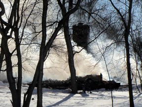 The ruins of a home continue to smoke following a fire on Old Bridge Road just before 2:00 a.m. Tuesday morning. The home was completely destroyed by the fire, and one occupant was transported to hospital. (ROBIN DUDGEON/PORTAGE DAILY GRAPHIC/QMI AGENCY)