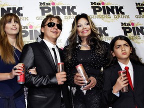 Paris (L), Prince (2nd L) and Blanket (R), children of the late Michael Jackson, pose next to their aunt La Toya Jackson at the Mr. Pink Ginseng Drink launch party at the Beverly Wilshire Hotel in Beverly Hills, California, October 11, 2012. REUTERS/Jonathan Alcorn