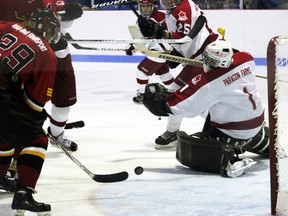 Norwich goalie Matt McGonigle slides over in time to make a pad save during a flurry of offence in front of his crease during the second period of game 1 Feb. 15, 2013. The Merchants went on to win 3-2 to take an early lead in their second-round series against the Paris Mounties. GREG COLGAN/QMI Agency