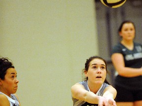 SARAH DOKTOR Simcoe Reformer
Holy Trinity's Raven Gamble reaches to bump the ball during an exhibition game against Brantford's St. John's College on Feb. 19. Holy Trinity won in five sets.