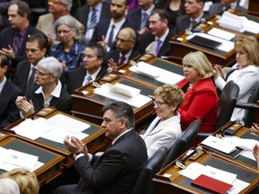 Premier Kathleen Wynne and fellow Liberals listen a s Lt.-Gov. David Onley delivers the throne speech at Queen's Park in Toronto on Tuesday, Feb. 19, 2013. (Ernest Doroszuk/Toronto Sun)
